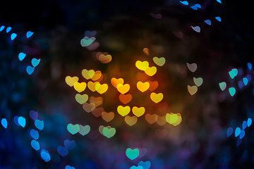 Abstract beautiful blurred background of gold-yellow orange and red colored of heart bokeh from...