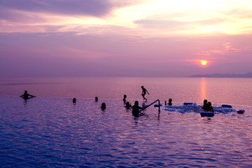 People swimming having fun in the pool