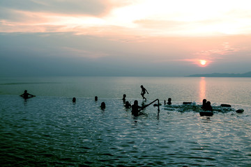 People swimming having fun in the pool