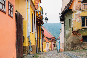 Sighisoara old town street colorful houses in Romania