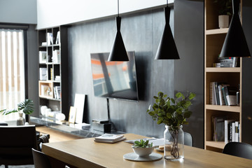 Stylish Dining Area in modern style with wood and gray color theme in natural light setting scene /...