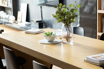 Stylish Dining Area in modern style with wood and gray color theme in natural light setting scene / stylish interior design / cozy dining area