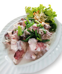 Stir fried squid with coconut milk on white dish