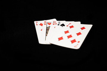Bad poker hand on black background