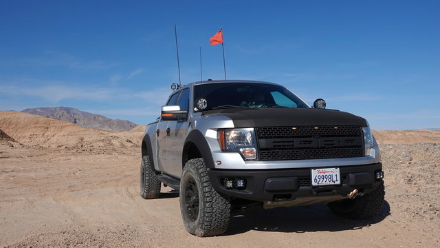 2011 Ford F-150 Raptor SVT driving off-road in a desert OHV state park. 2011 body style is the same as 2012, 2013 and 2014. Photo taken in Ocotillo Wells, CA / USA - November 26, 2019. 