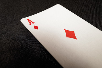 Red Ace of Diamonds on black background