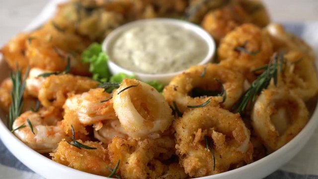 fried seafood (squids, shrimps, mussels) with sauce