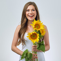 happy woman holding three sunflowers