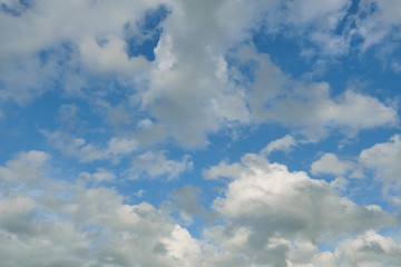 Obraz premium Cumulus cloud on beautiful blue sky , Fluffy clouds formations at tropical zone , Thailand 