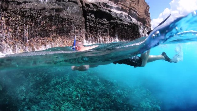 man snorkeling in the sea