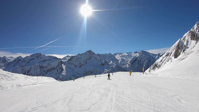 Ponte di Legno, Tonale, Italy. Skiing on the slopes in a wonderful day. POV from the skier. Point of view from the ski helmet. Italian Alps