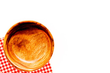 Wooden dishes. Bowl closeup on white background top view copy space