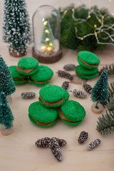 Home made green christmas sugar cookies on a festive christmas background