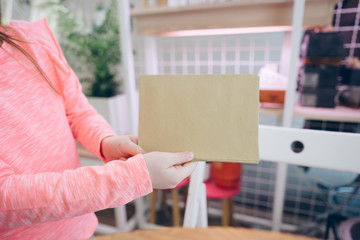 Child showing paper sheet for sales advertisement, copy space.