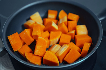 Sliced carrots on a teflon pan. Close view