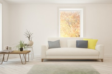 Stylish room in white color with sofa and autumn landscape in window. Scandinavian interior design. 3D illustration