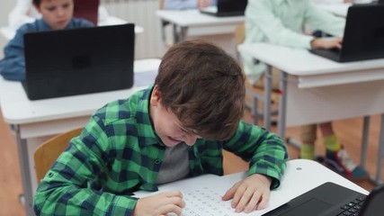 Education at modern school, schoolboy got a good grade on test work, happy and positive emotion. - Powered by Adobe