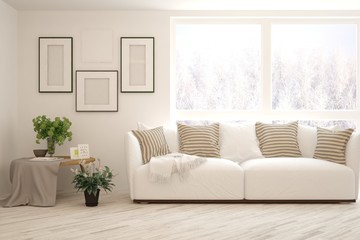 Stylish room in white color with sofa and winter landscape in window. Scandinavian interior design. 3D illustration