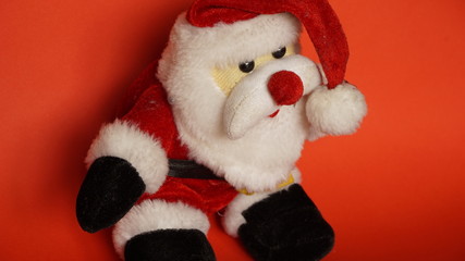teddy bear as santa claus in a red background