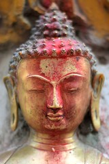 Bronze image of the head of Buddha in the streets of Kathmandu, Nepal