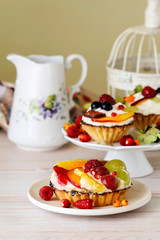 Colorful cupcakes with fresh fruits.