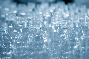 The stock of the PET bottles in the warehouse  waiting for drinking water manufacturing process. The plastic bottles after blowing process keep in wear house.