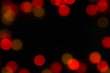 Colorful bokeh lights Beautiful glittering   on black background On christmas day With copy space.