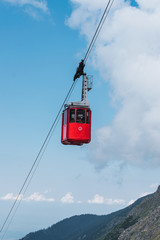 Fototapeta premium Cable railway among highland country and blue sky