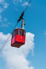 Ropeway with cabin at clear sky