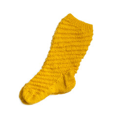 Warm knitted yellow female sock closeup. Isolate