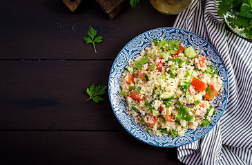 Traditional Lebanese Salad Tabbouleh. Couscous with parsley, tomato, cucumber, lemon and olive oil....