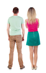Back view of couple. beautiful friendly girl and guy together.