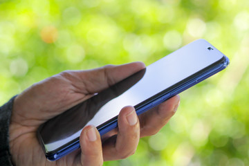 A man using smartphone for connect to social network.