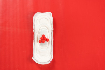 close up of woman hygiene protection on red background