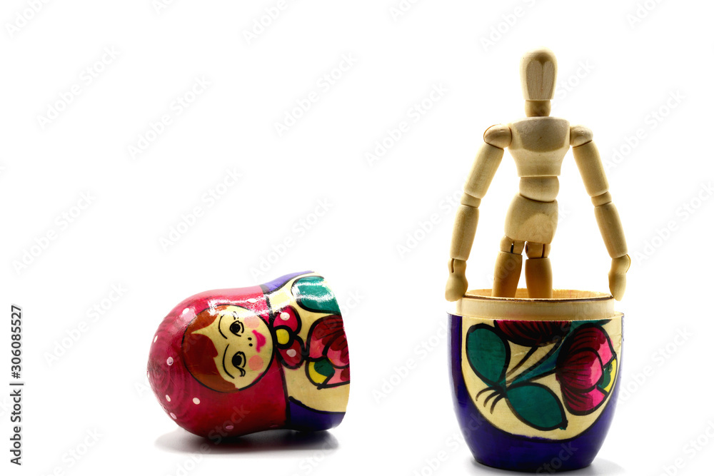 Wall mural wooden toy Matryoshka and wooden mannequin