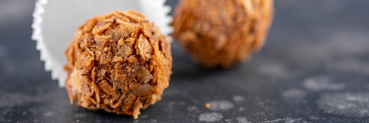 Homemade candy on a dark background. Sweet gift concept. Macro. Banner.