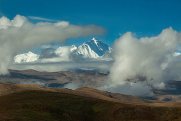 Mount Everest seen through the clouds from Everest Base Camp, Tibet