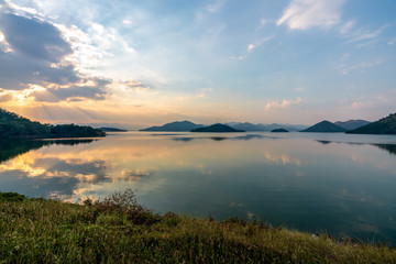 beautiful blue sky green forest mountains lake view at Kaeng Krachan National Park, Thailand.  an idea for backpacker hiking on long weekend or a couple, family holiday activity camping relaxing