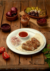 lule kebab with side onion and ketchup