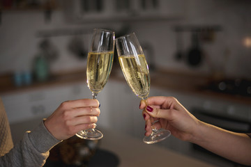 toasting champagne in the kitchen