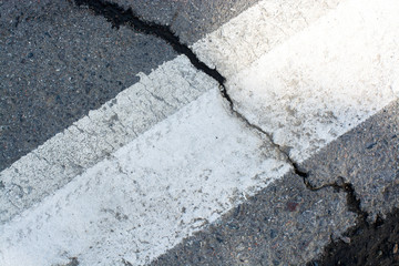 The road with the barbell string. Asphalted stone without lysing details. Last summer.