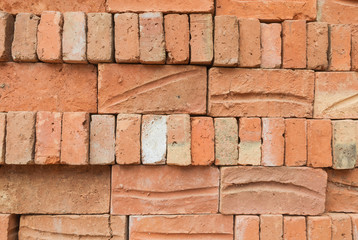 Obraz premium Old red brick stacked wall background texture