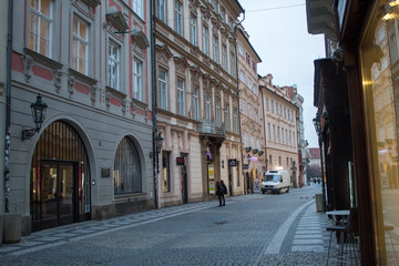 Cityscape of architecture and ancient streets of the Czech capital of Prague early in the morning before Christmas.