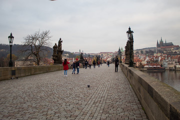 The oldest bridge in Prague Charles Bridge at dawn on the eve of the Christmas holidays with virtually no tourists.