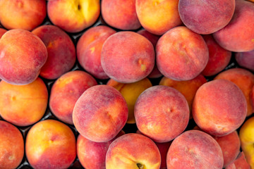 Рeaches fruit background at farmers' markets. summer pattern.