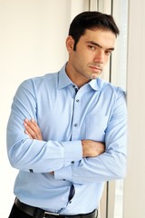 portrait of handsome man hugged his against the pole in the office,Close up shot 