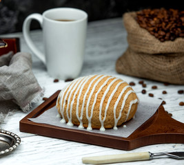 Fototapeta na wymiar sack with coffee beans and bread topped with cream