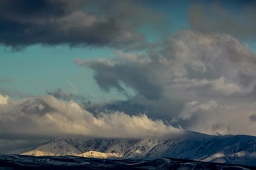 Fototapeta na wymiar Clouds over the hill. Nature of Kazakhstan.