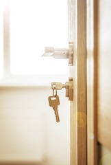 Door lock , door open in front of room blur background