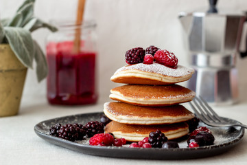 Pancakes with blackberries, raspberries and red currants. American cuisine.